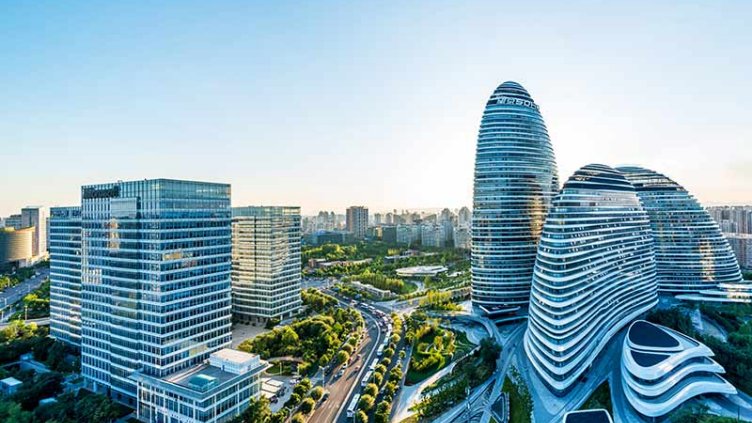 Top view of high rise glass office buildings in a smart city