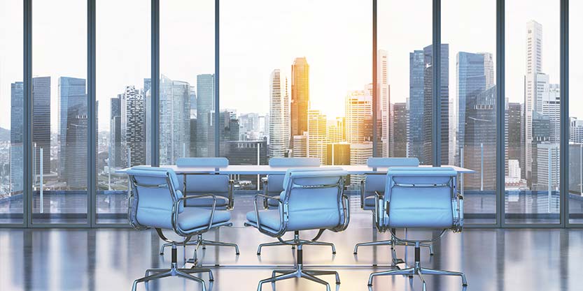 Conference table with a city view in behind 