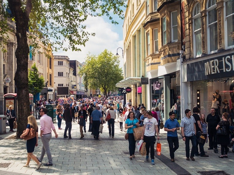 Queen Street, one of Cardiff's main shopping streets, busy with Saturday shoppers.