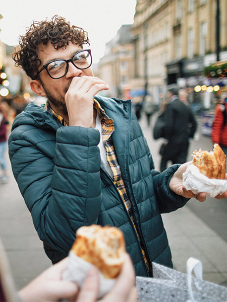 Person is eating and laughing