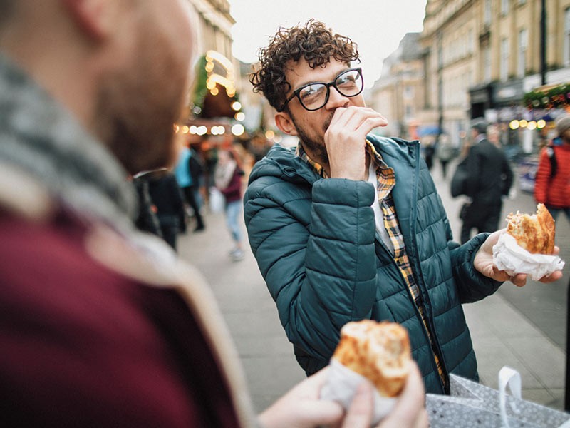 Person is eating and laughing