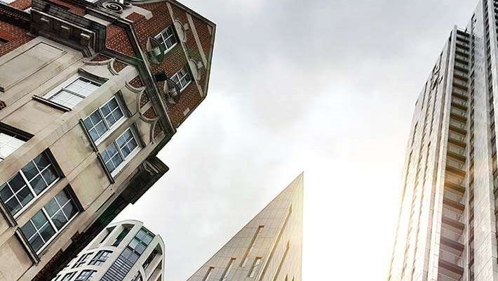 Contrast between old building and new glass and steel office towers in Old Street in London, England