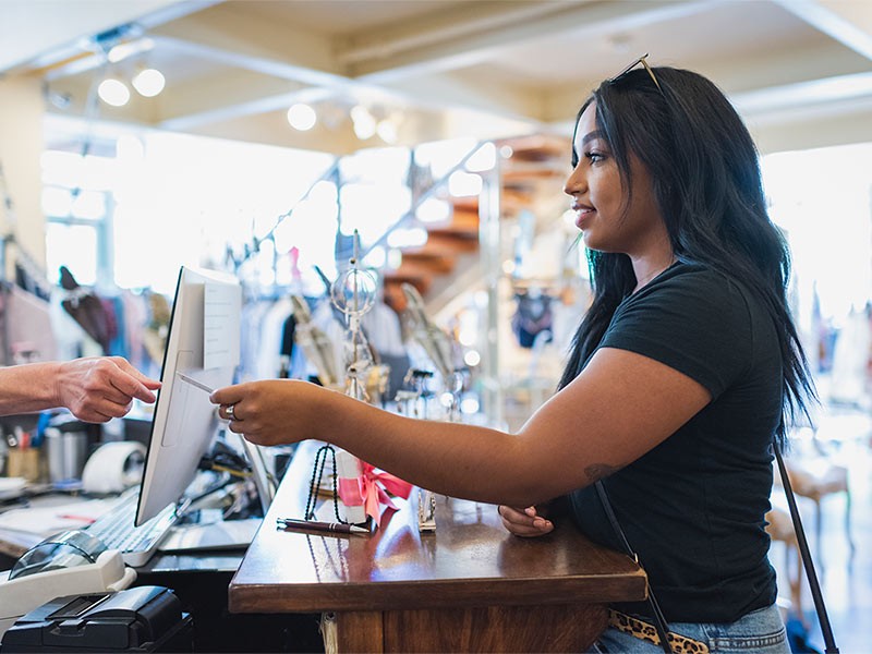 A female paying bill for shopping