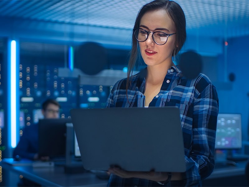 Data center employee working on Laptop