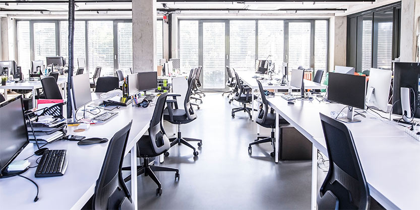 A view of empty chairs and desks at the office.