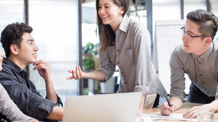 Employees discussing at meeting room