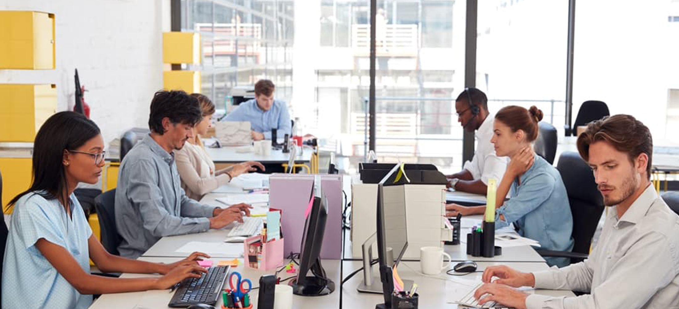 workers in an open plan work space